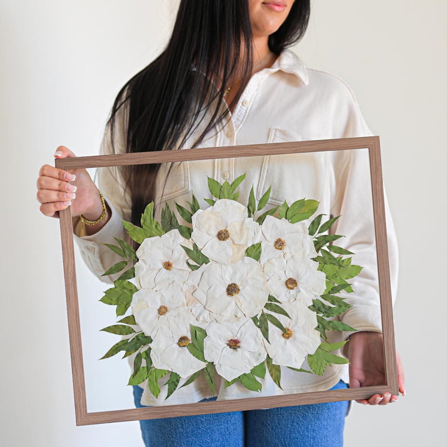 a girl carry flower preservation frame