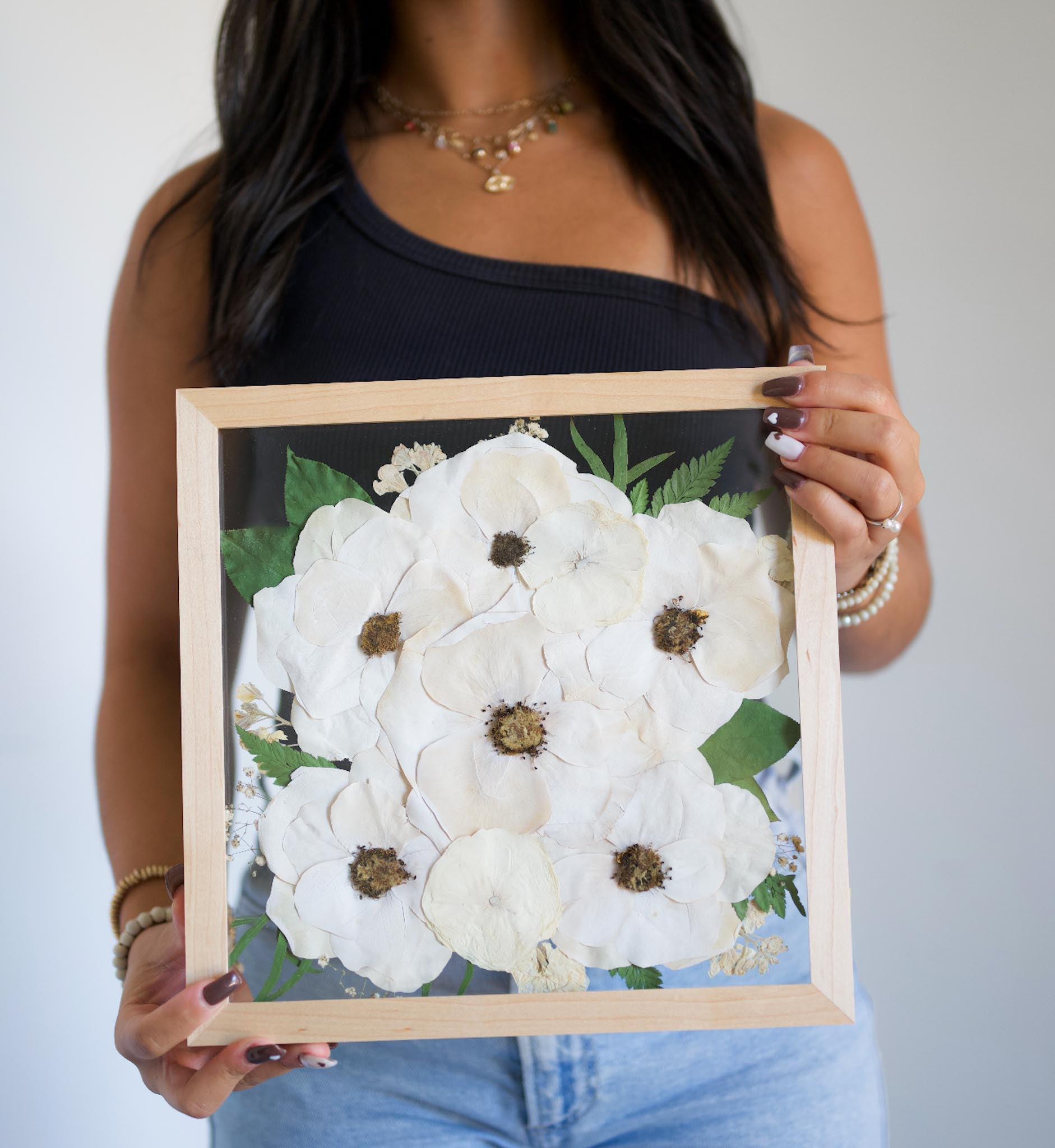 white flowers preserved in frame