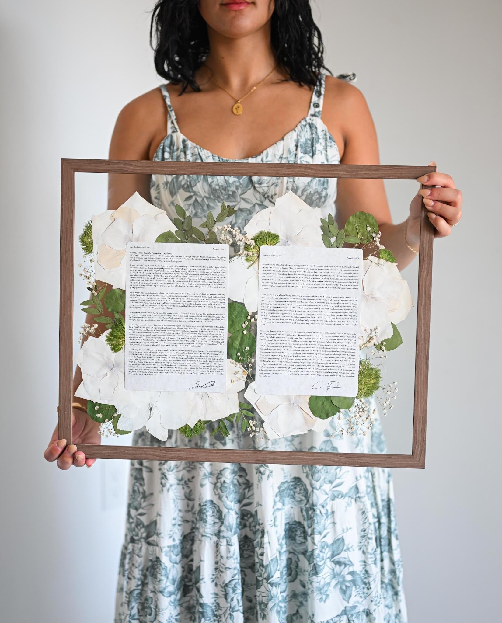 A person holding a 16 x 20 Wooden Vows Frame 