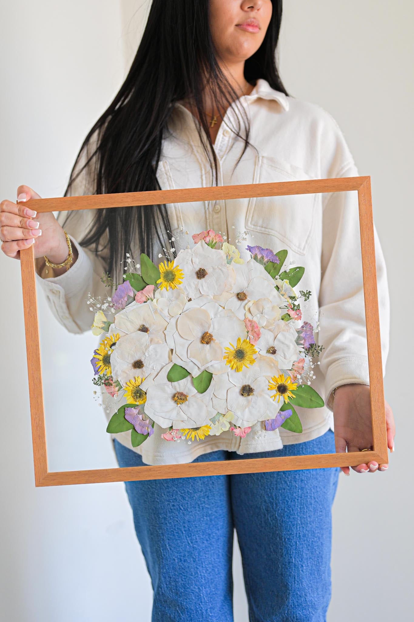 wooden frame with preserved floral arrangements