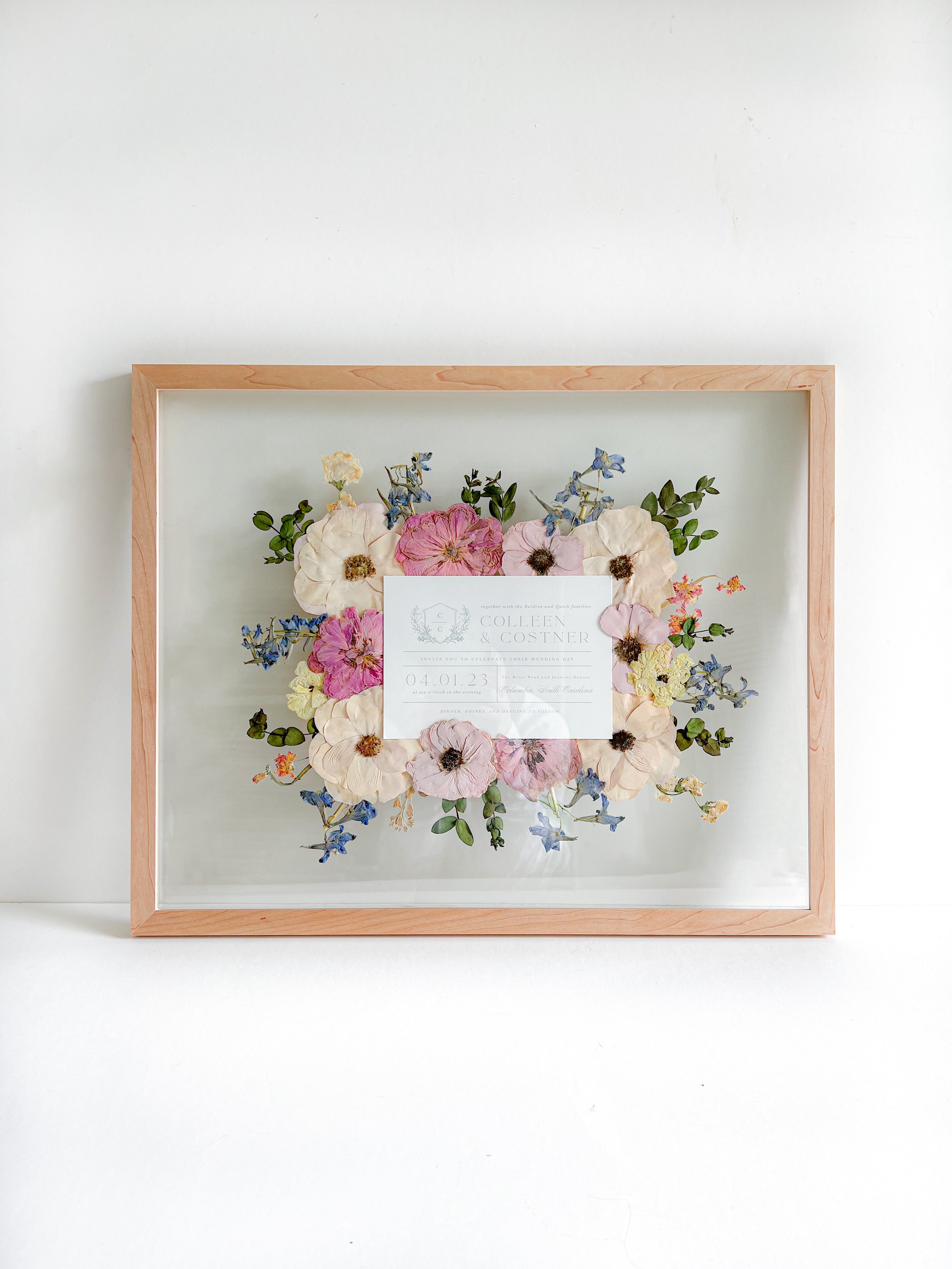 invitation frame decorated with  flowers and green leaves