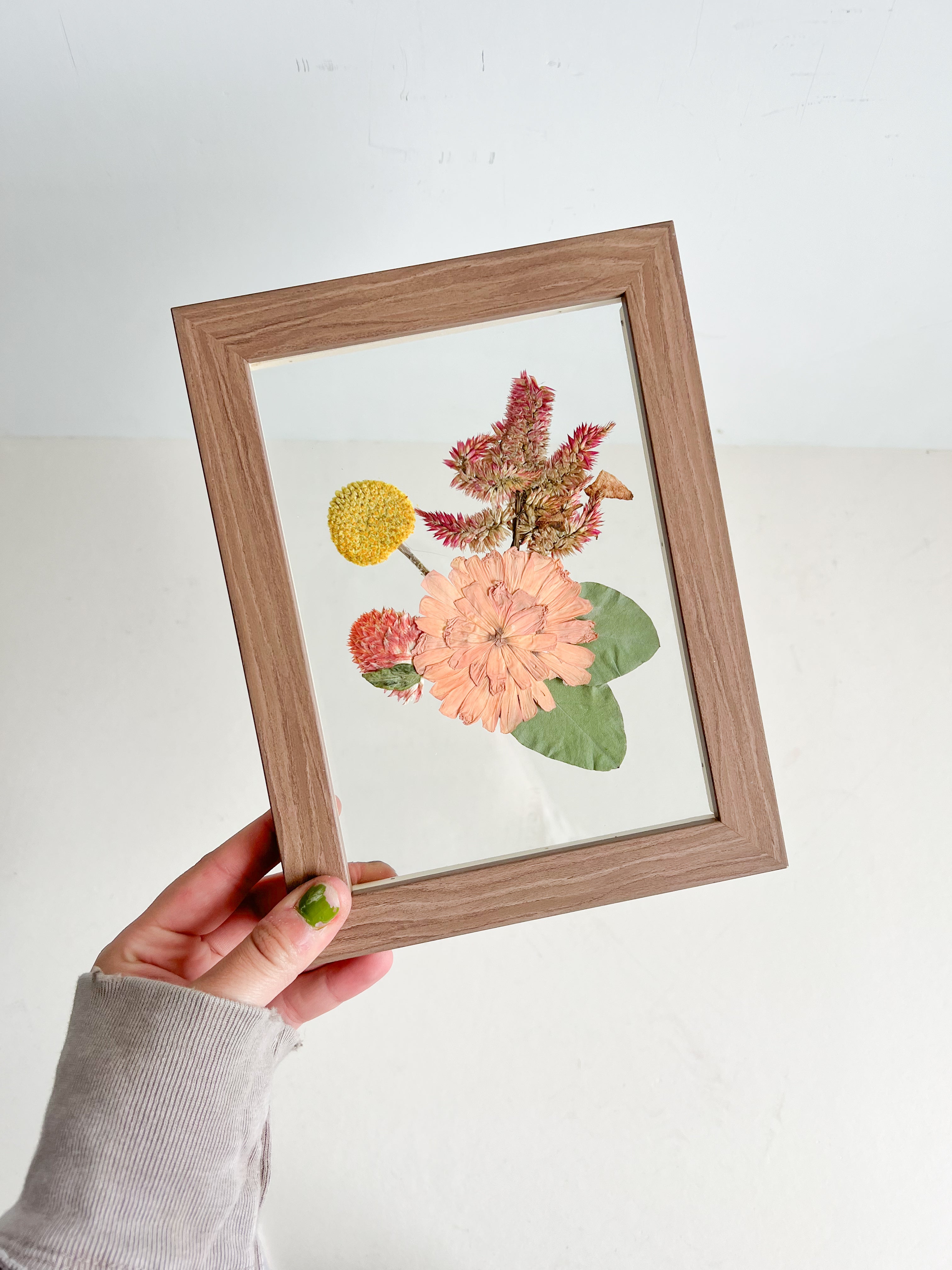 framed boutonniere with pressed flowers 