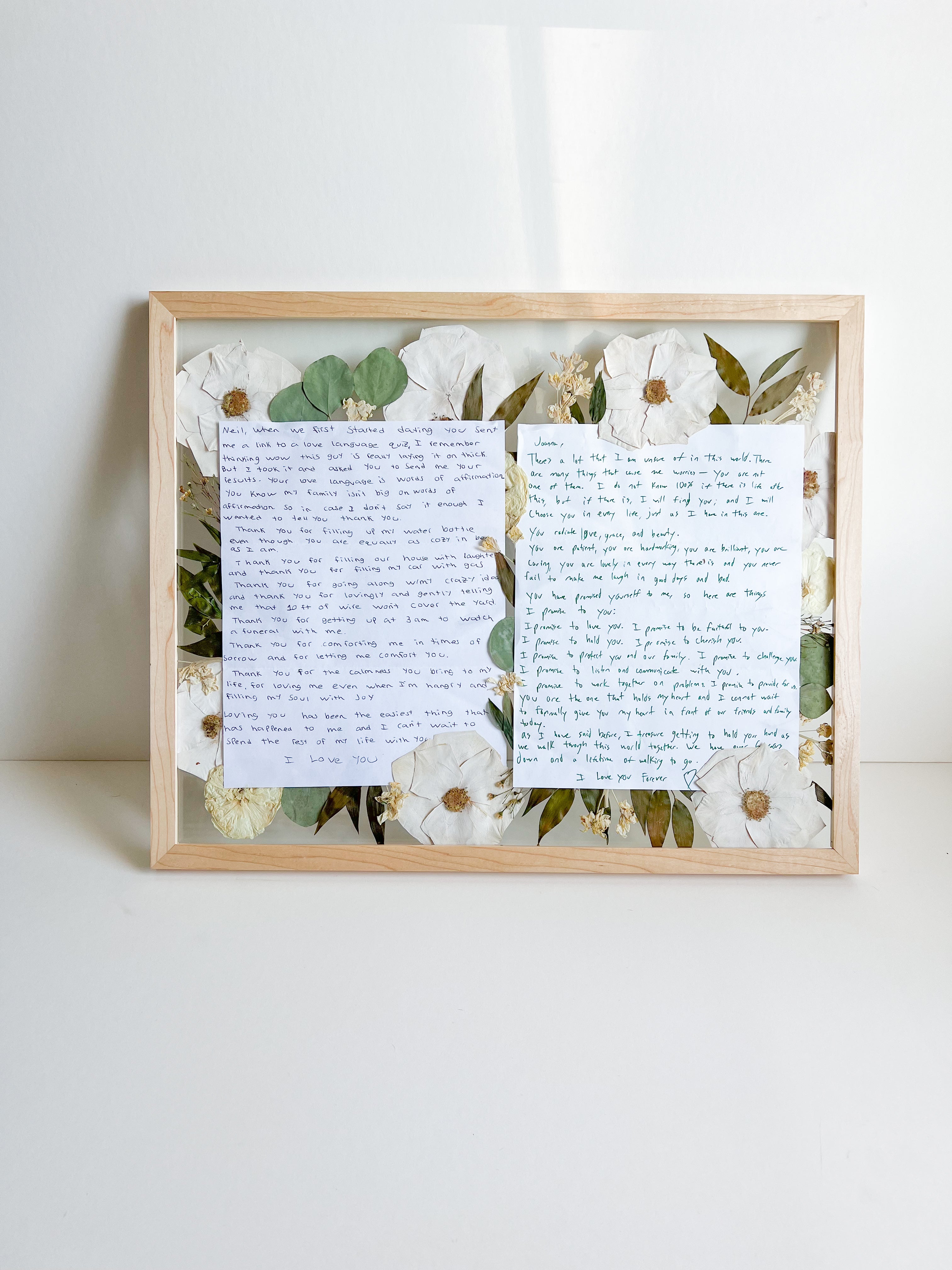 wooden white flower vows frame