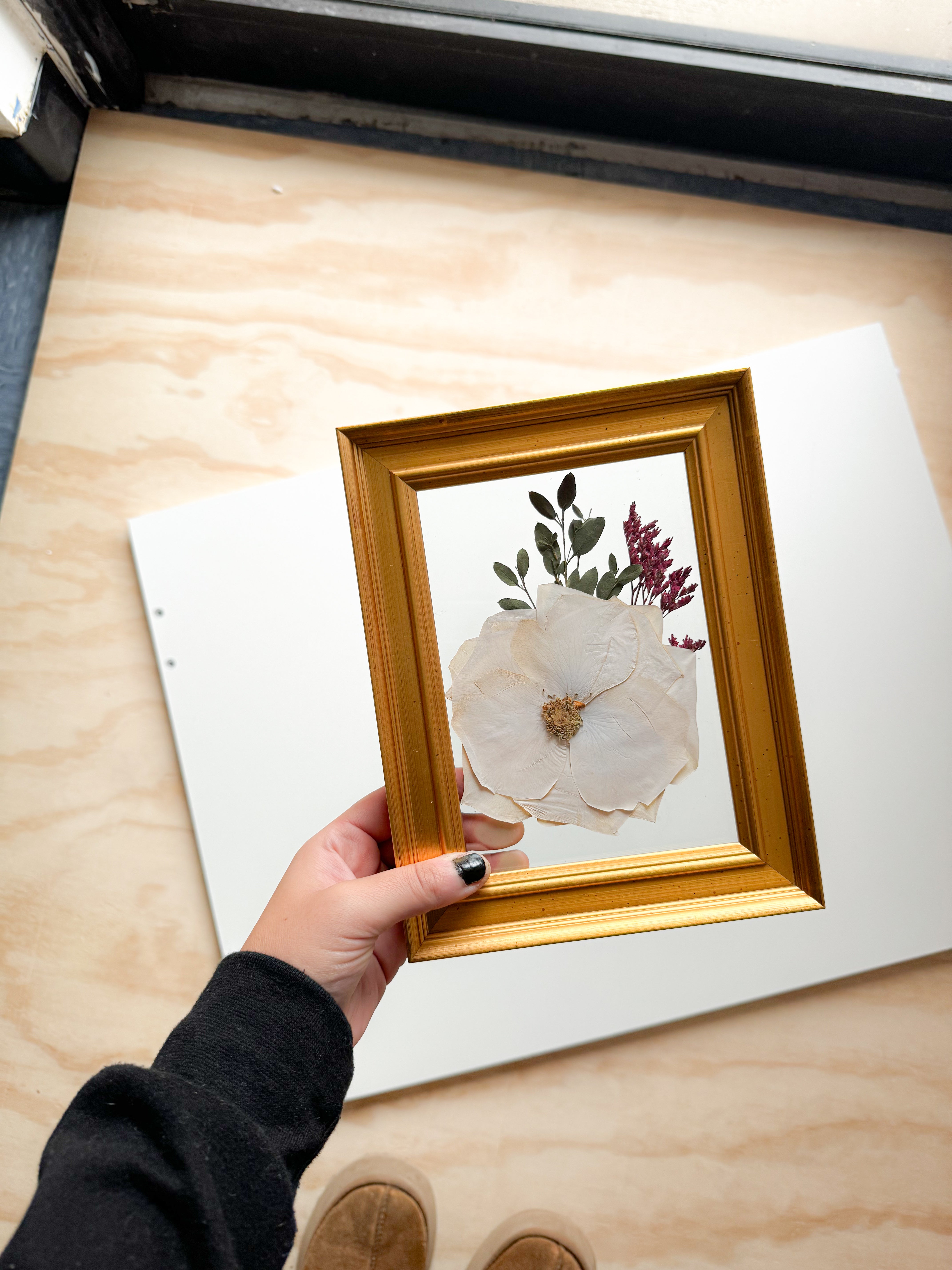 white pressed flower frame